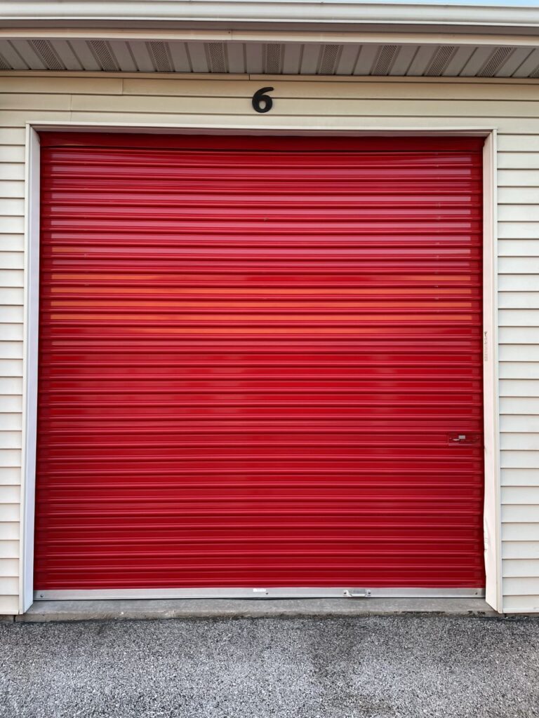 Outside of red roll-up door storage unit at Red Barn Storage in Davenport, Iowa