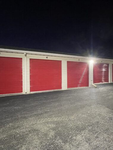 Drive-up Storage Units at Red Barn Storage in Davenport, Iowa at night with paved driveway (Units 1 to 7)