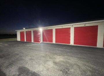 Drive-up Storage Units at Red Barn Storage in Davenport, Iowa at night with paved driveway (Units 6 to 11)