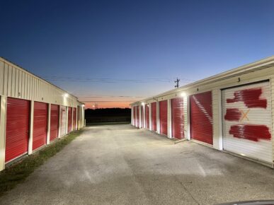 Multiple Storage Units at Red Barn Storage in Davenport, Iowa at night with security lights on