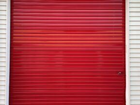 Outside of red roll-up door storage unit at Red Barn Storage in Davenport, Iowa