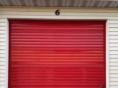 Outside of red roll-up door storage unit at Red Barn Storage in Davenport, Iowa